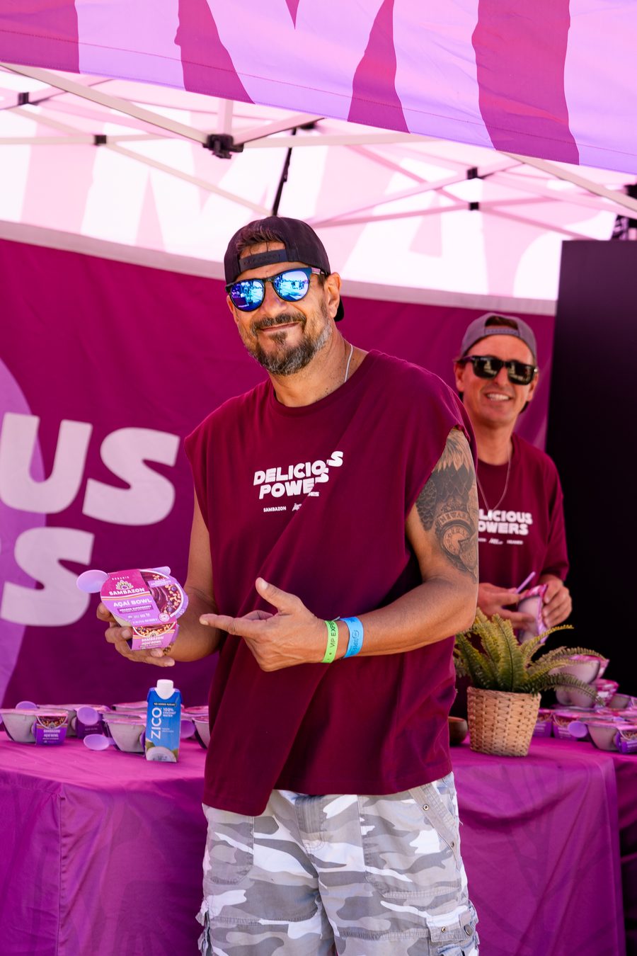 A vendor holding a sample at his booth