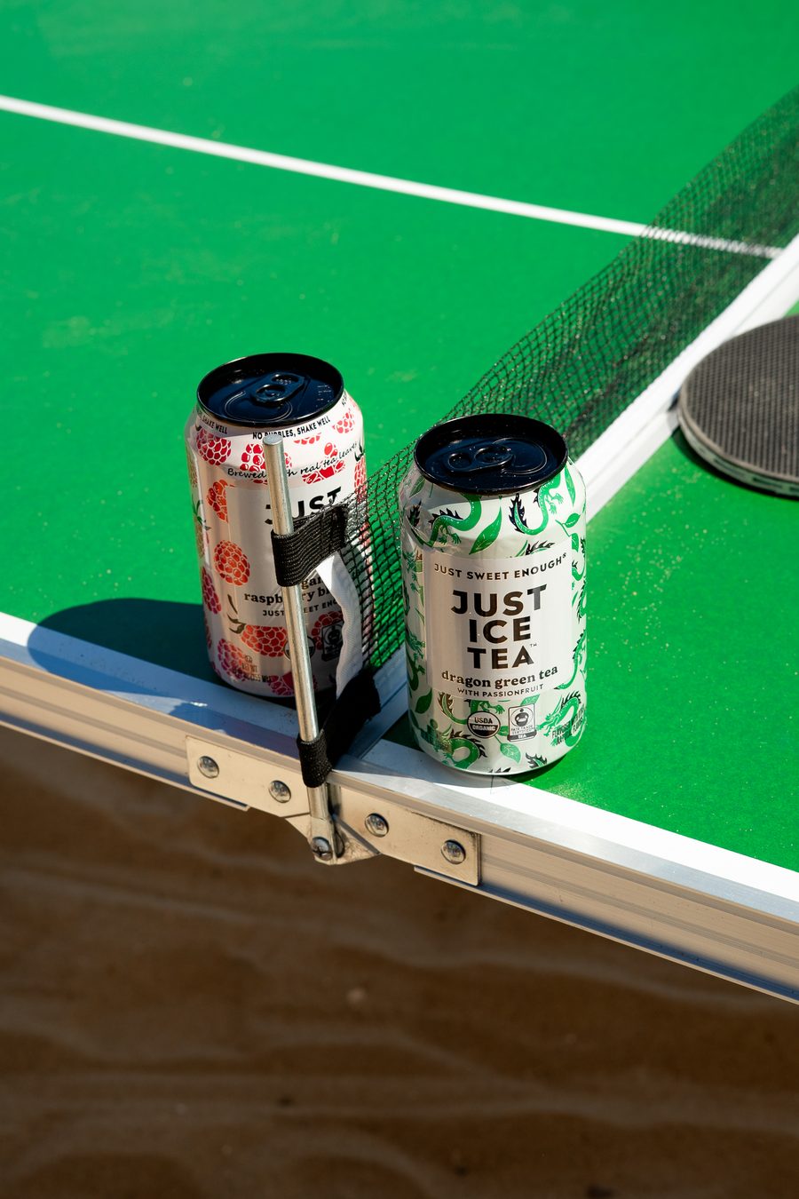 Cans left on the edge of a table between games